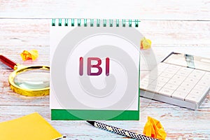 Business Customer Management Analysis Service. IBI on a white notebook photo