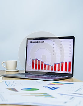 business data graph on laptop with copy space for making presentation