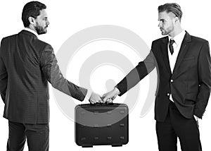 Business deal between businessmen in suits. Businessmen with ser