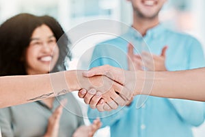 Business deal, handshake and partnership with employees shaking hands in b2b office agreement after negotiation. Hiring