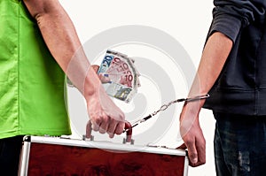 Business deal - One man delivery to other man a briefcase