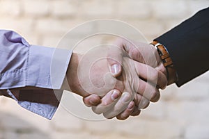 Business deal between two business man giving handshake