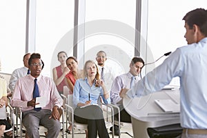 Business Delegates Listening To Presentation At Conference