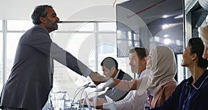 Business delegates shaking hands at a conference