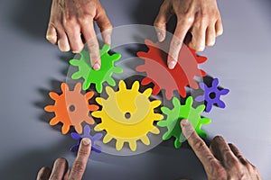 Business development, teamwork and partnership concept - people connecting gears