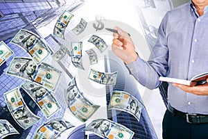 Business development to success. Businessman with heap of dollar money photo