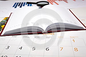 Business diary with calendar and diagram