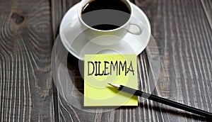 Business DILEMMA . Yellow stickers with text on wooden background with coffee