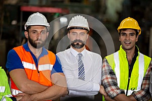 Business director and Mechanic engineer checking and discussing at factory shop floor