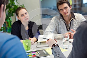 Business Discussion young People in casual Clothing Man pointing