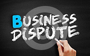 Business dispute text on blackboard photo