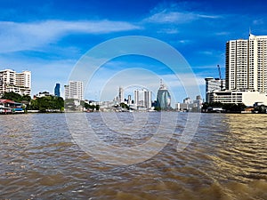 The business district of Bangkok behin the river