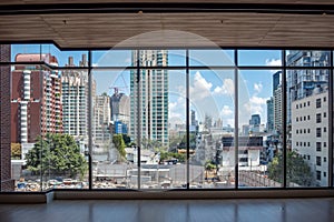 Business district and clouds blue sky view from big glass windows in building