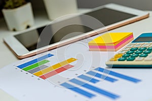 Business document chart and graph analysis finance information investment report on desk at office