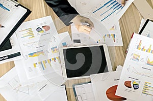 Business documents with charts growth, keyboard and pen