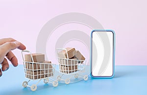Business ecommerce or online shopping concepts with c2c and smartphone and product box order in trolley