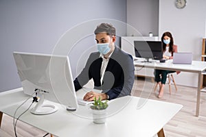 Business Employees In Office Wearing Medical Masks