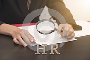 Business employer holding magnifying glass searching. concept HR