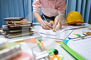 Business engineer contractor working at his desk table in office