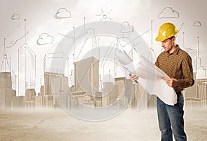 Business engineer planing at construction site with city background