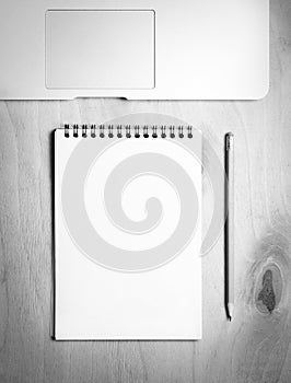 Business essentials. Top view of spiral blank notebook