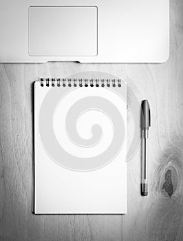 Business essentials. Top view of spiral blank notebook