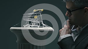 Business executive and dusty miniature shopping cart