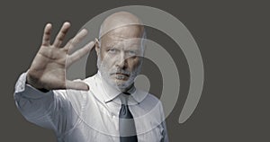 Business executive making a stop gesture