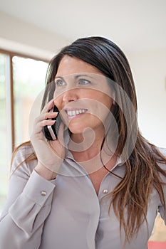 Business executive on phone while smiling