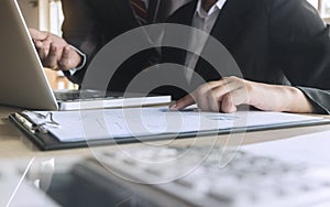 Business executives analysis data document with accountant at workplace