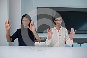 Business executives gesturing in boardroom