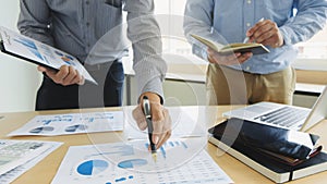 Business executives partner analysis data document with accountant at workplace