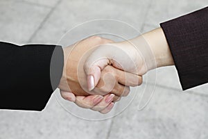 Business executives power hand shake