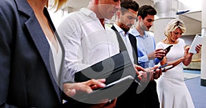 Business executives using digital tablet and mobile phone