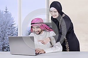 Business family using laptop at home