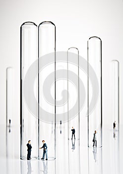 Business figurines and test tubes photo