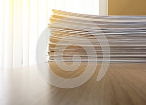 Business file documents paper stack on office wood table