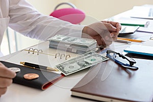 Business and finance concept, Hand of a businessman giving money to his partner