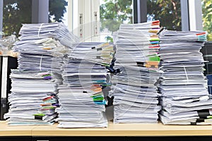 Business and finance concept of office working, Pile of unfinished documents on office desk, Stack of business paper