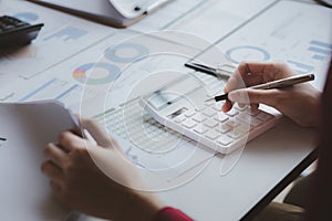 A business finance man is reviewing a company\'s financial documents prepared