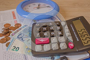 Business, finance, saving money or investment concept : Coin stacks, pen, clock and savings account passbook