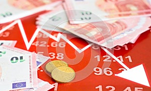 Business, finance, tax and people concept - close up of woman hands counting euro money with calculator and tax report form