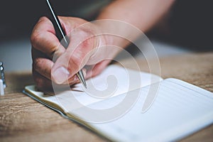 Businessman writing a book Note taking Note taking concept