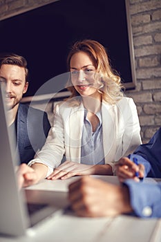 business, finances, economics and technology - business woman working on computer.