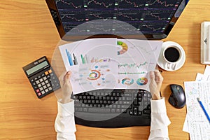 Business and financial concept  Top view hands of business women holding report chart. Hands of business people holding chart and