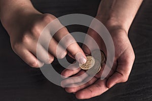 Business financial success concept. coins in the palm of your hand