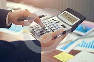 Business financing accounting banking and word small business displayed on calculator on graph growth background photo
