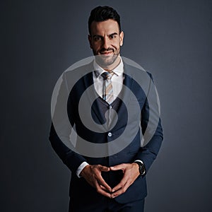 In business, focus is everything. Studio shot of a stylish and confident young businessman posing against a gray