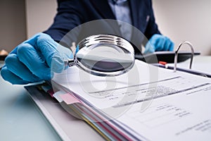 Business Fraud Investigation With Magnifying Glass