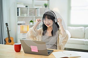 Business freelance entrepreneur woman wearing eyeglass and white headphone hand up cheerful successful, working typing keyboard on